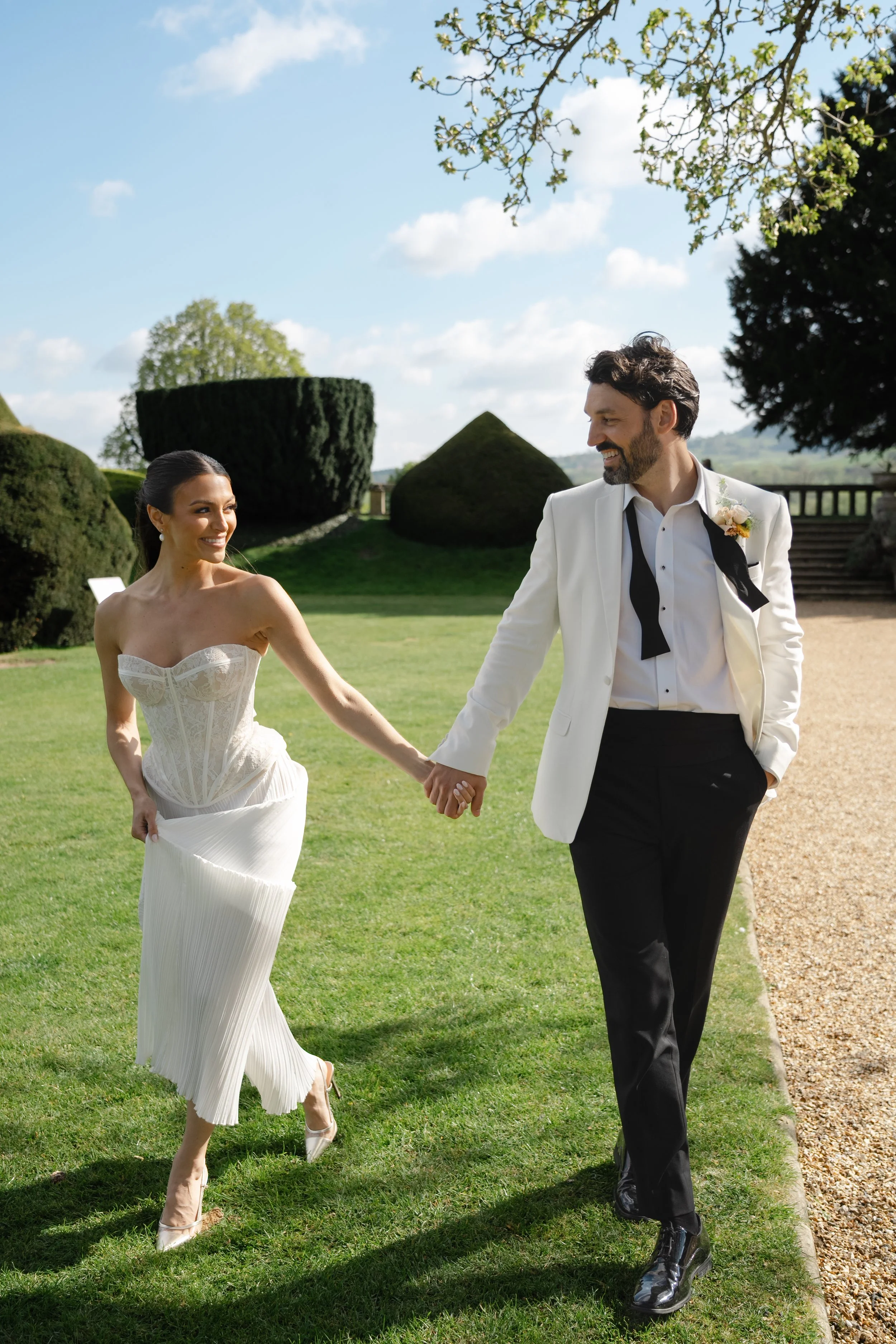 bride and groom in castle gardens
