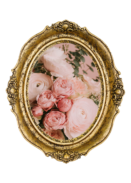 A vintage gold ornate oval frame displaying a floral arrangement of pink and white roses and ranunculus with green foliage.