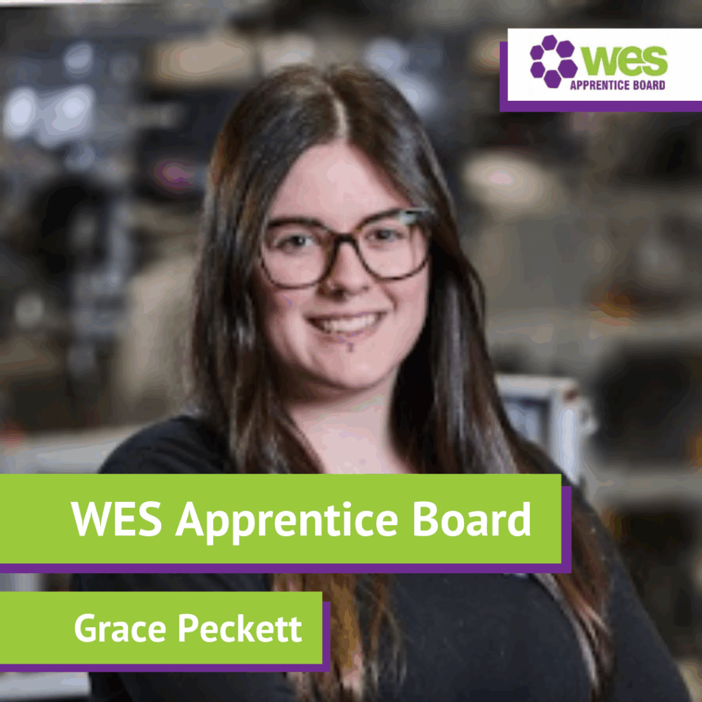 Portrait of a young woman with brown hair and glasses, smiling, in a professional environment, with the WES Apprentice Board logo and text overlay reading "WES Apprentice Board" and "Grace Peckett".