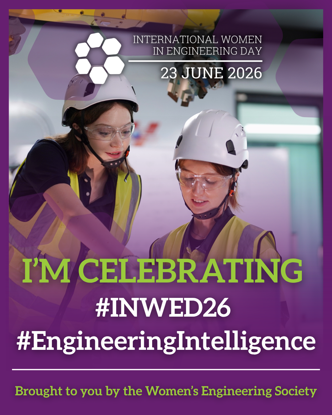 Two women in hard hats and safety vests examining technical equipment inside an industrial or engineering facility, celebrating International Women in Engineering Day on June 23, 2026.