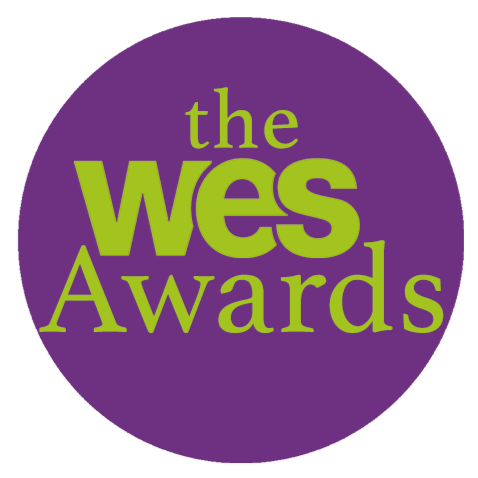 Logo for the WES Awards with purple background and green text.