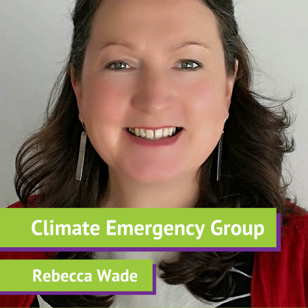 A woman with shoulder-length brown hair, smiling, wearing a red blazer, earrings, and a black-and-white striped top, with text overlay reading "Climate Emergency Group" and "Rebecca Wade."