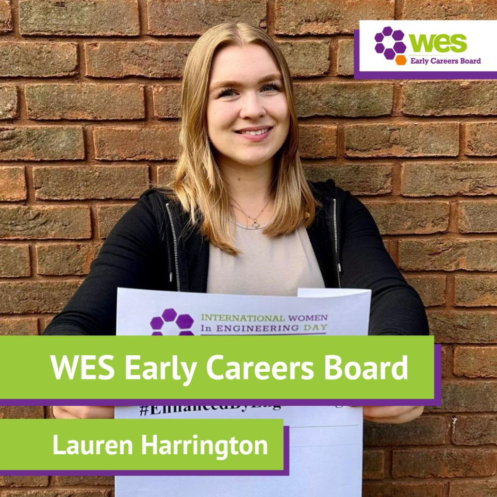 A young woman standing in front of a brick wall, holding a sign related to International Women in Engineering Day, with a logo for WES Early Careers Board in the top right corner.
