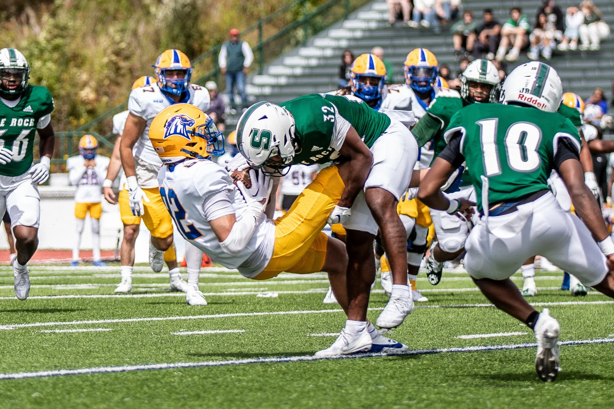 SRU football player makes a tackle. 