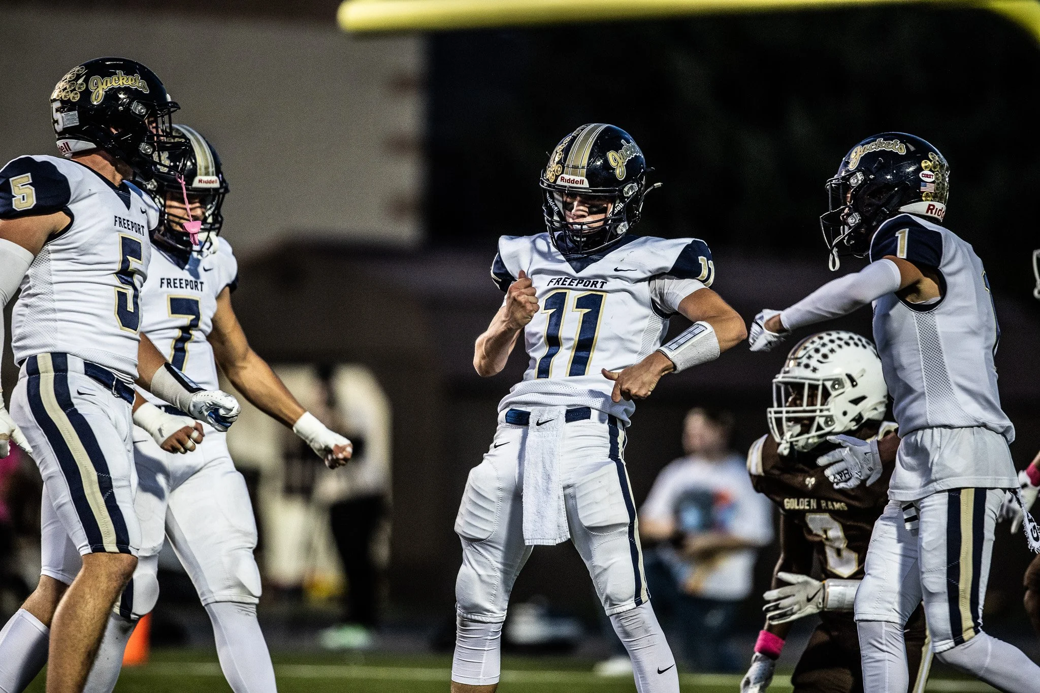 Knoch players celebrate after breaking up a pass. 
