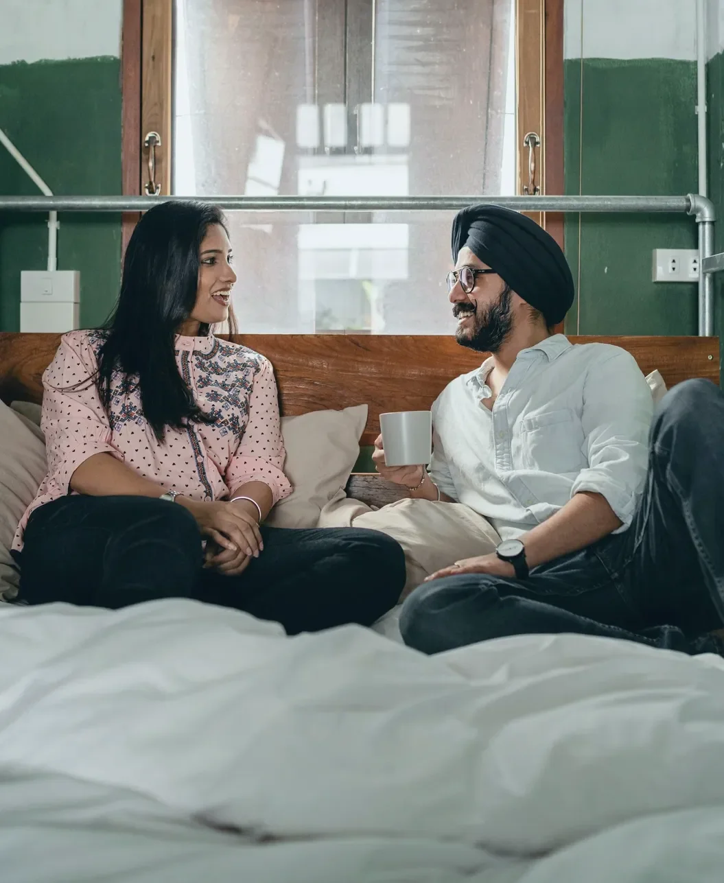 Couple in conversation, working through something side by side.
