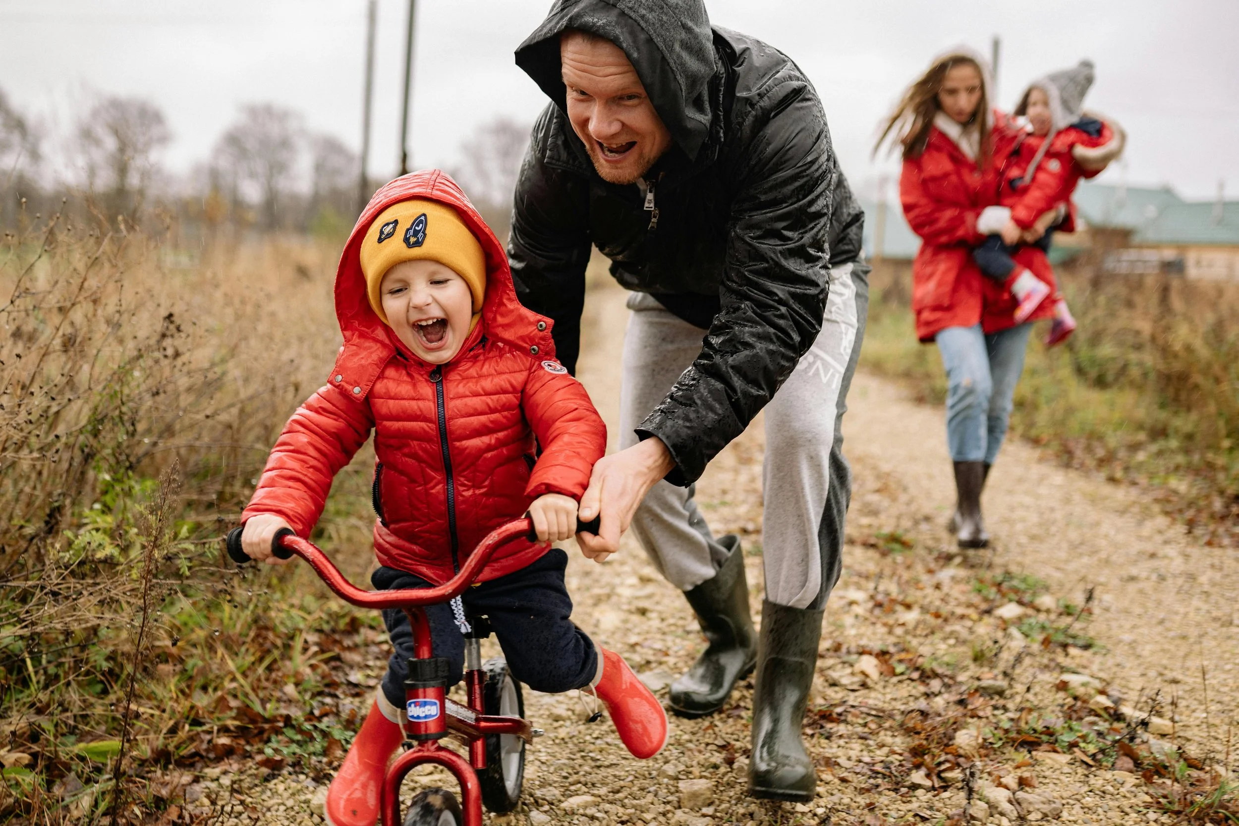 Family outdoors in rain gear, relationship counseling in East Greenwich RI