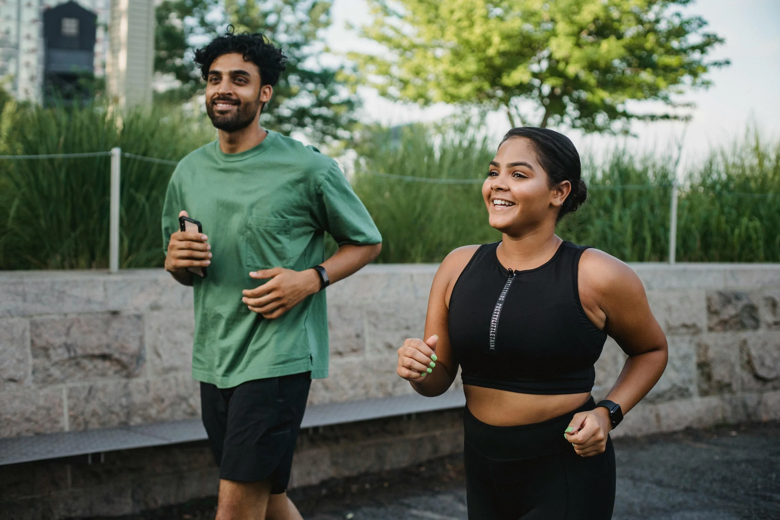 Two people running together outdoors, therapy for self-understanding East Greenwich RI