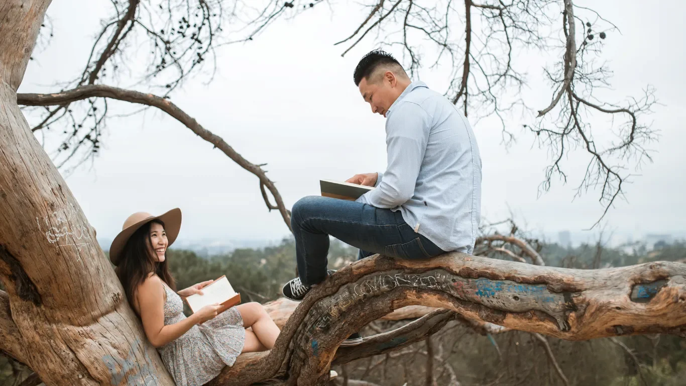 Couple sitting together on tree, relationship patterns therapy East Greenwich RI.