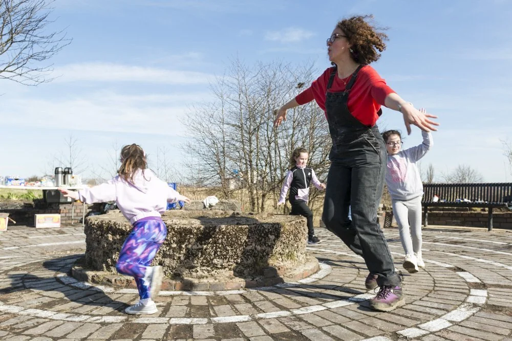 Participants walk the community labyrinth built on the Cowlairs site.