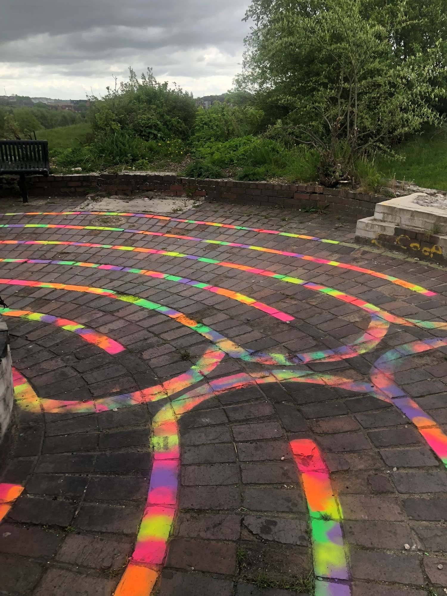 A line of multicolour tiles on the ground.