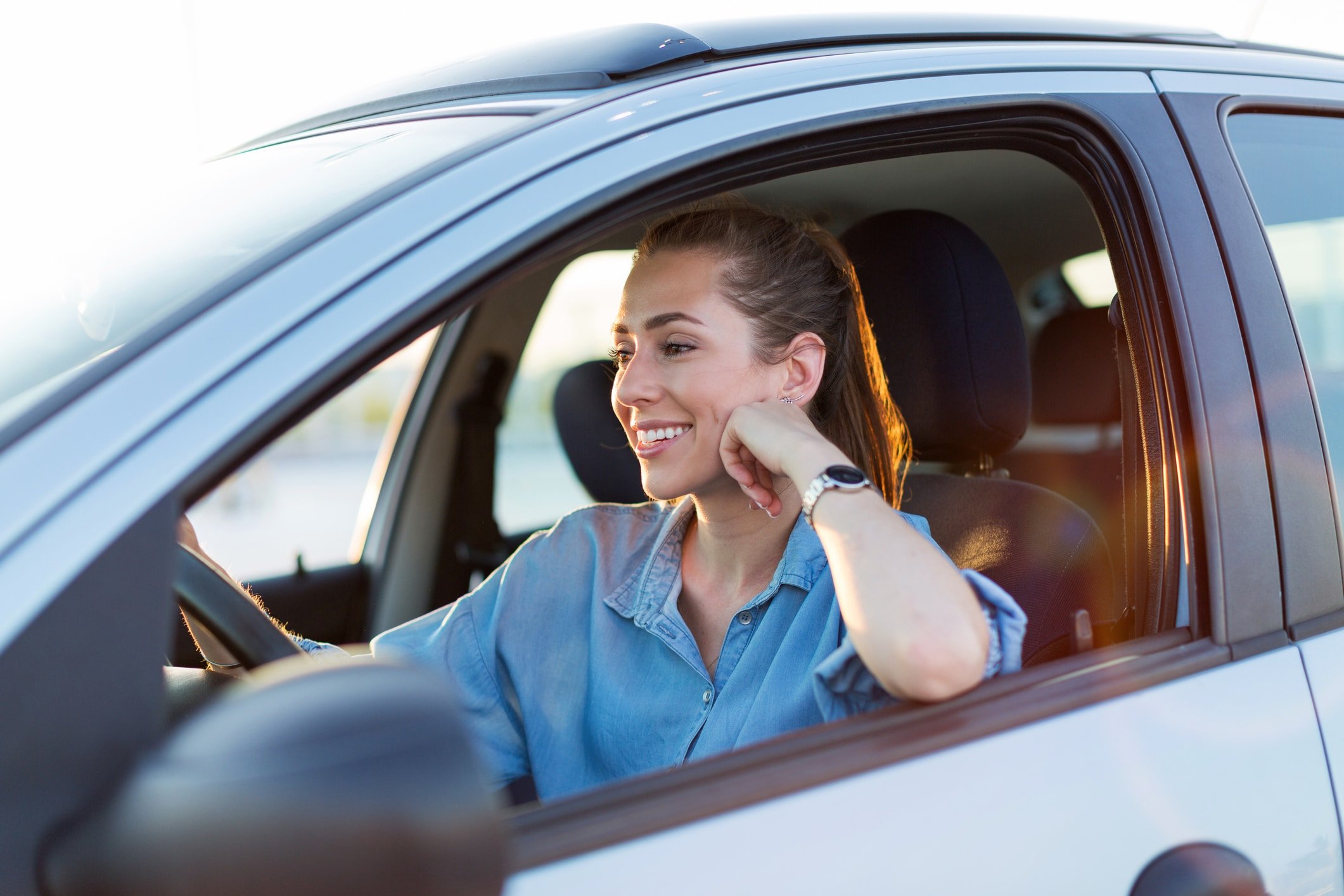 Female driver in car representing personal non-fault accident claim support