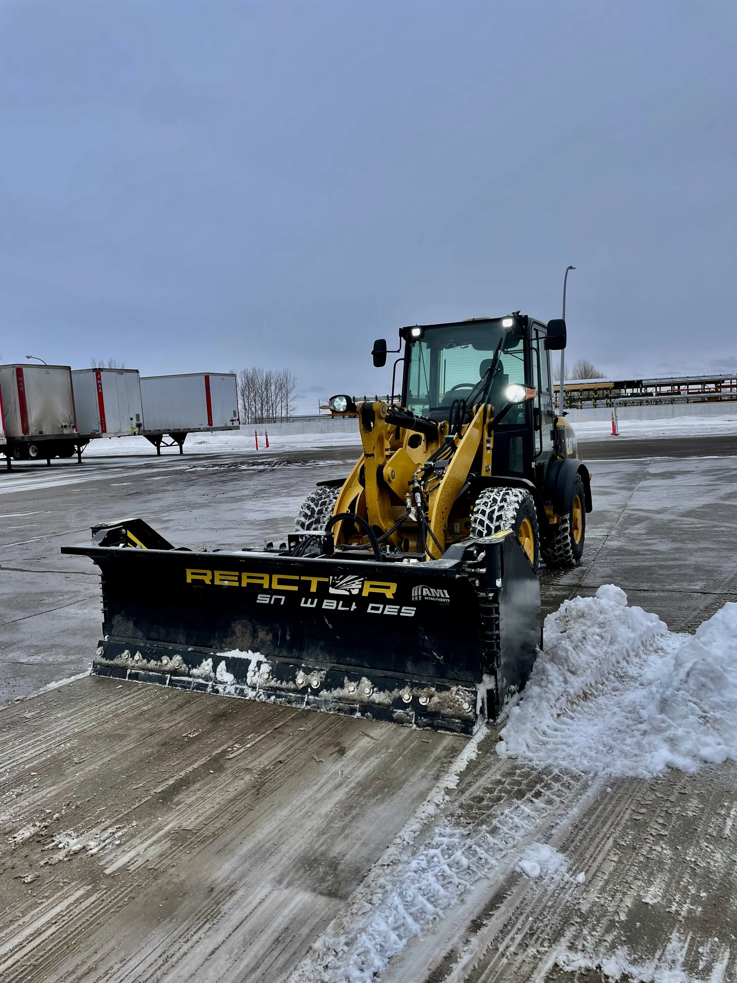Screenshot of a smartphone showing the time 8:54 and date Saturday, November 22, along with three text message notifications from a weather and snow removal service indicating storm alerts, snow in the area, and completion of property service.