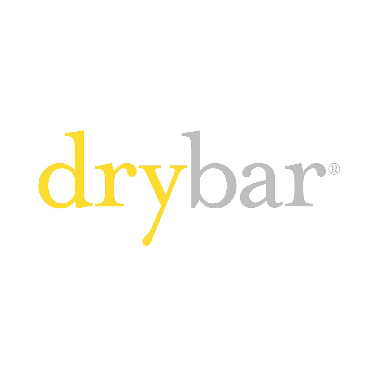 A logo with the words 'drybar' where 'dry' is in yellow and written in lowercase with a stylized 'y', and 'bar' in gray, also lowercase, with a registered trademark symbol to the right.
