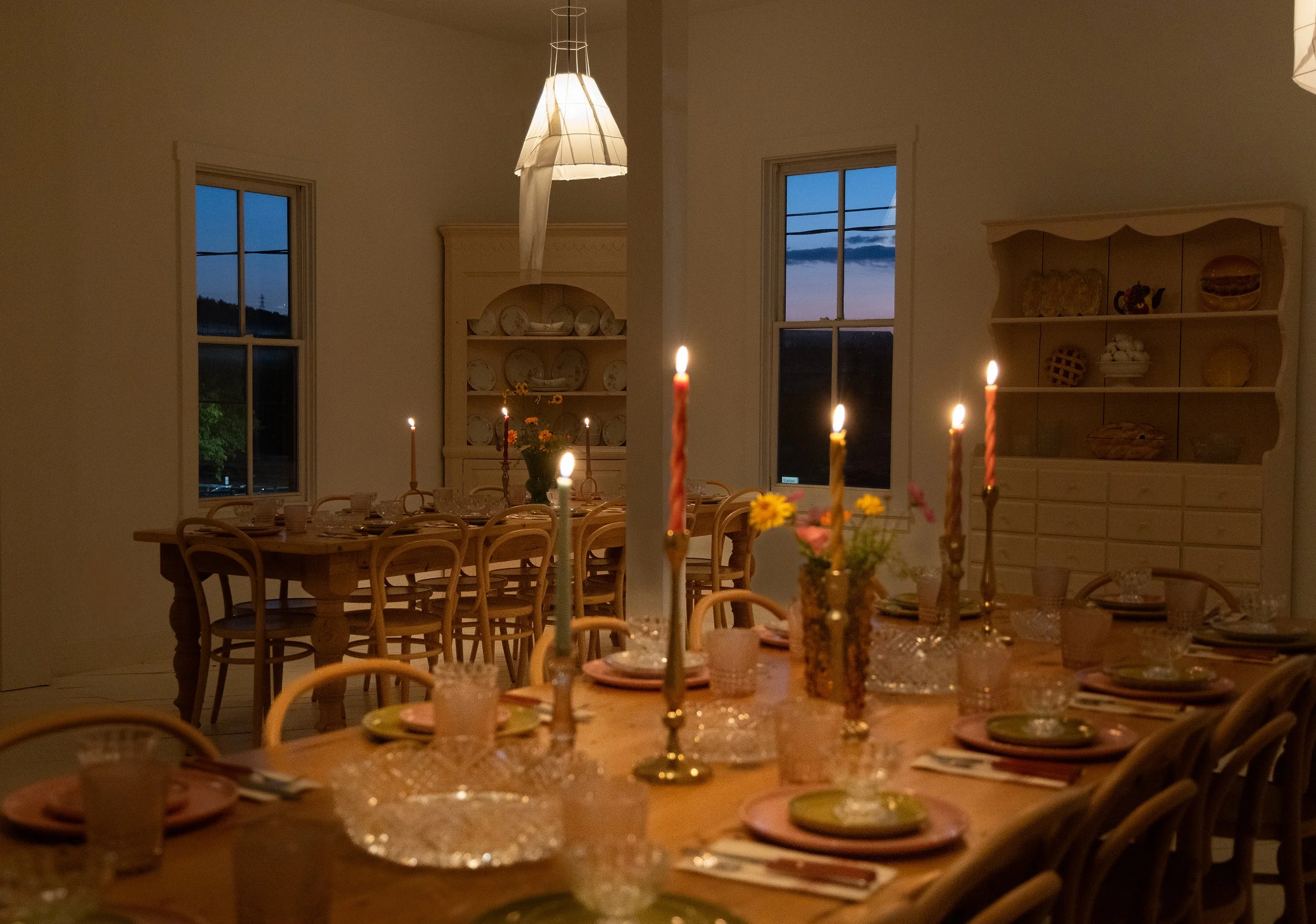 Group dining and private event setup at Mr. Cat Brasserie in Hudson NY in the upstairs during evening