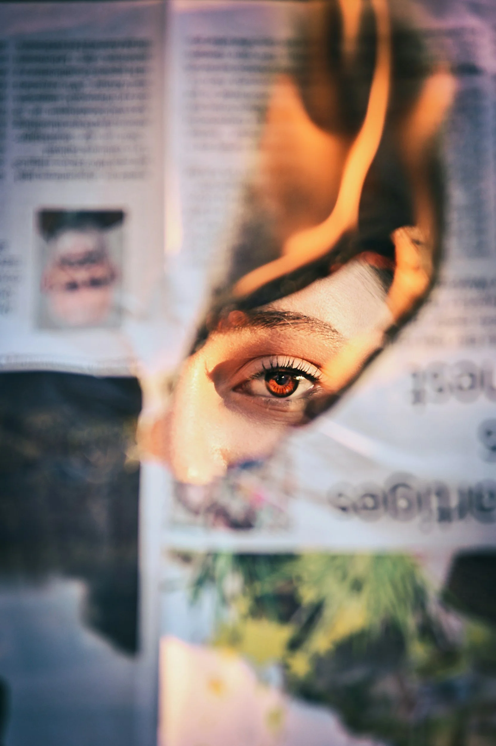 Abstract artistic close-up of a person looking through layers of text and documents, symbolizing the overwhelm of survival mode and the need for a stress management reset.