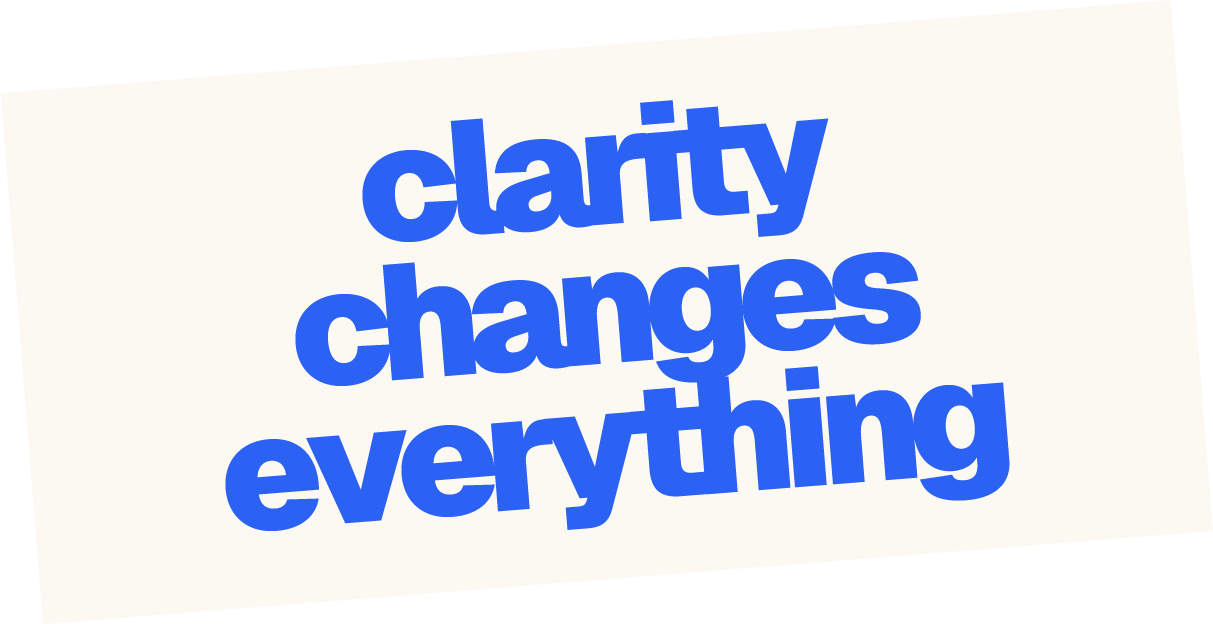 A sign with the phrase "clarity changes everything" written in bold blue letters on a white background, tilted at an angle.