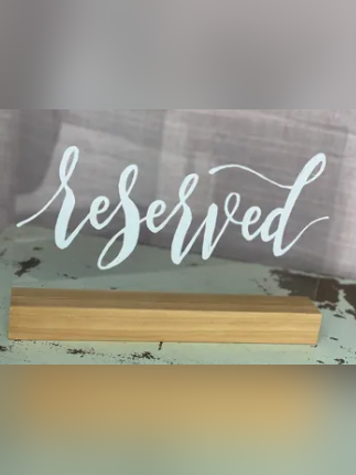 Clear 'reserved' sign decor rental