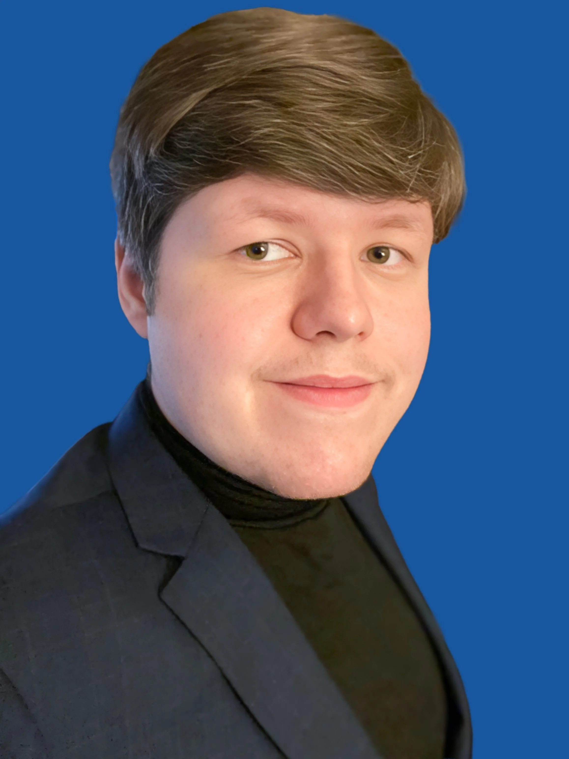 Portrait of a young man with brown hair, wearing a black turtleneck and a dark blazer, against a blue background.