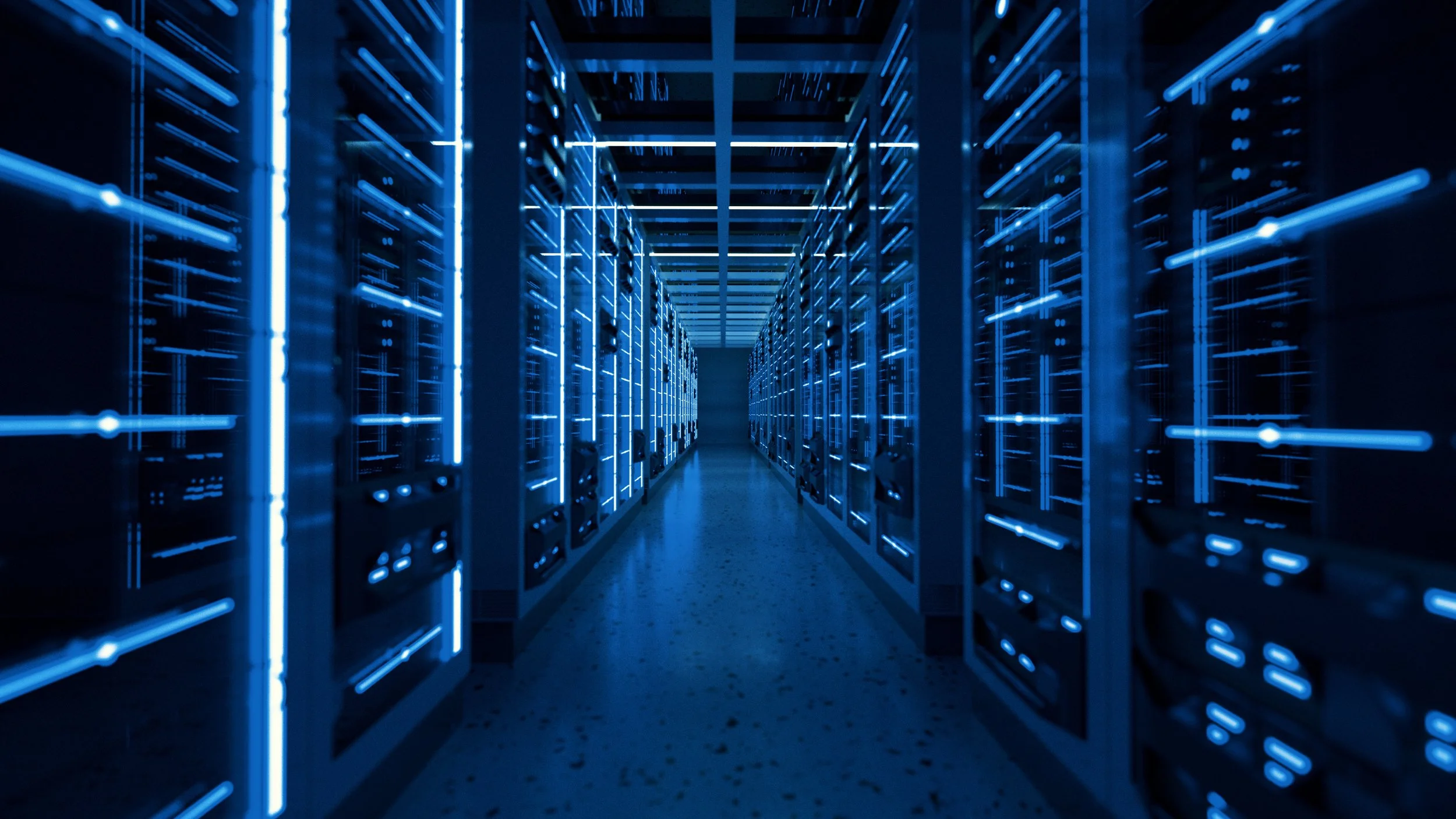 A row of server racks in a data center illuminated with blue LED lights, creating a futuristic atmosphere.