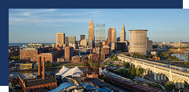 Skyline of downtown Cleveland with skyscrapers and the Cleveland Hopkins International Airport in the foreground.