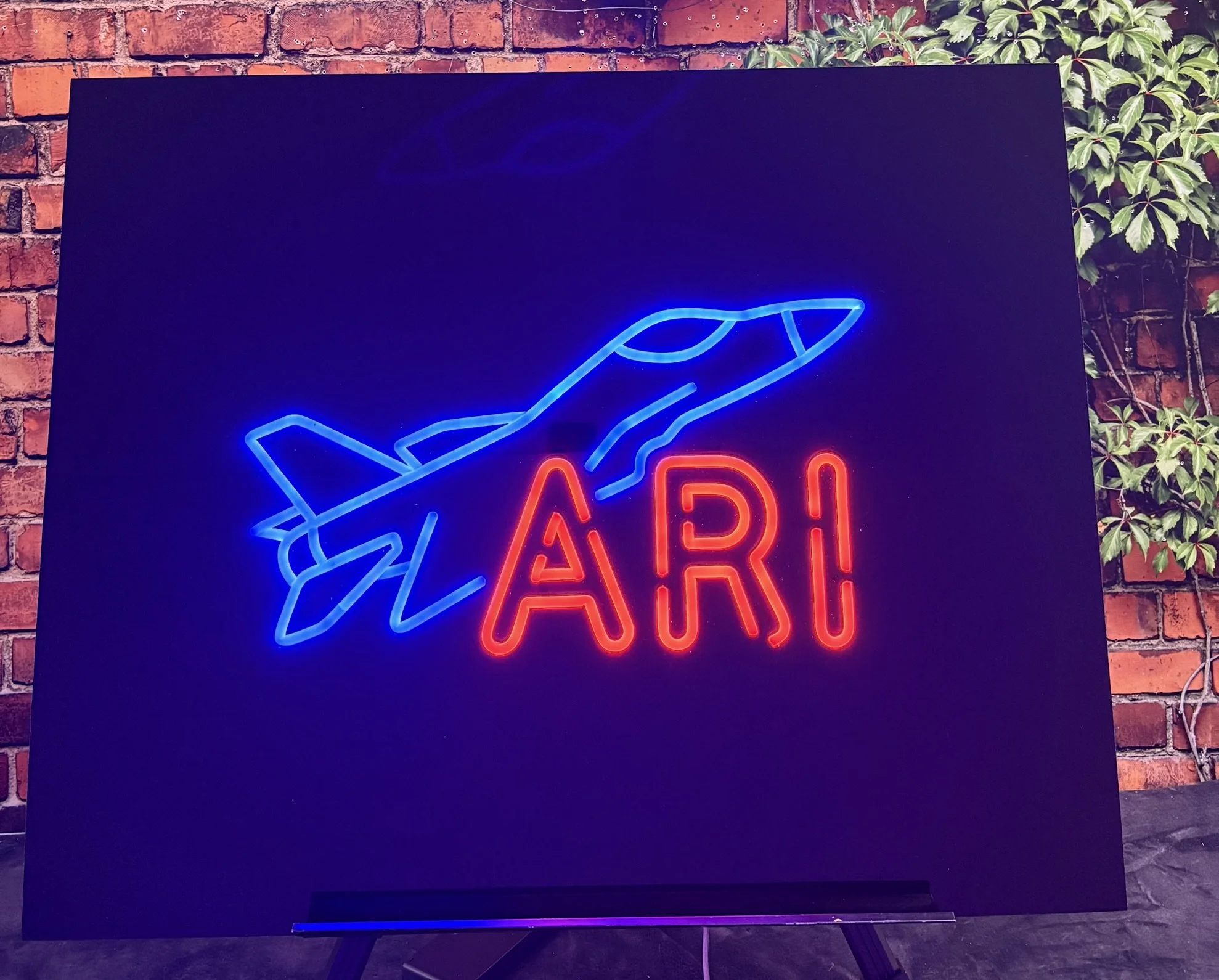 Airplane sign in board_Neon_Red and blue_Bar.JPEG