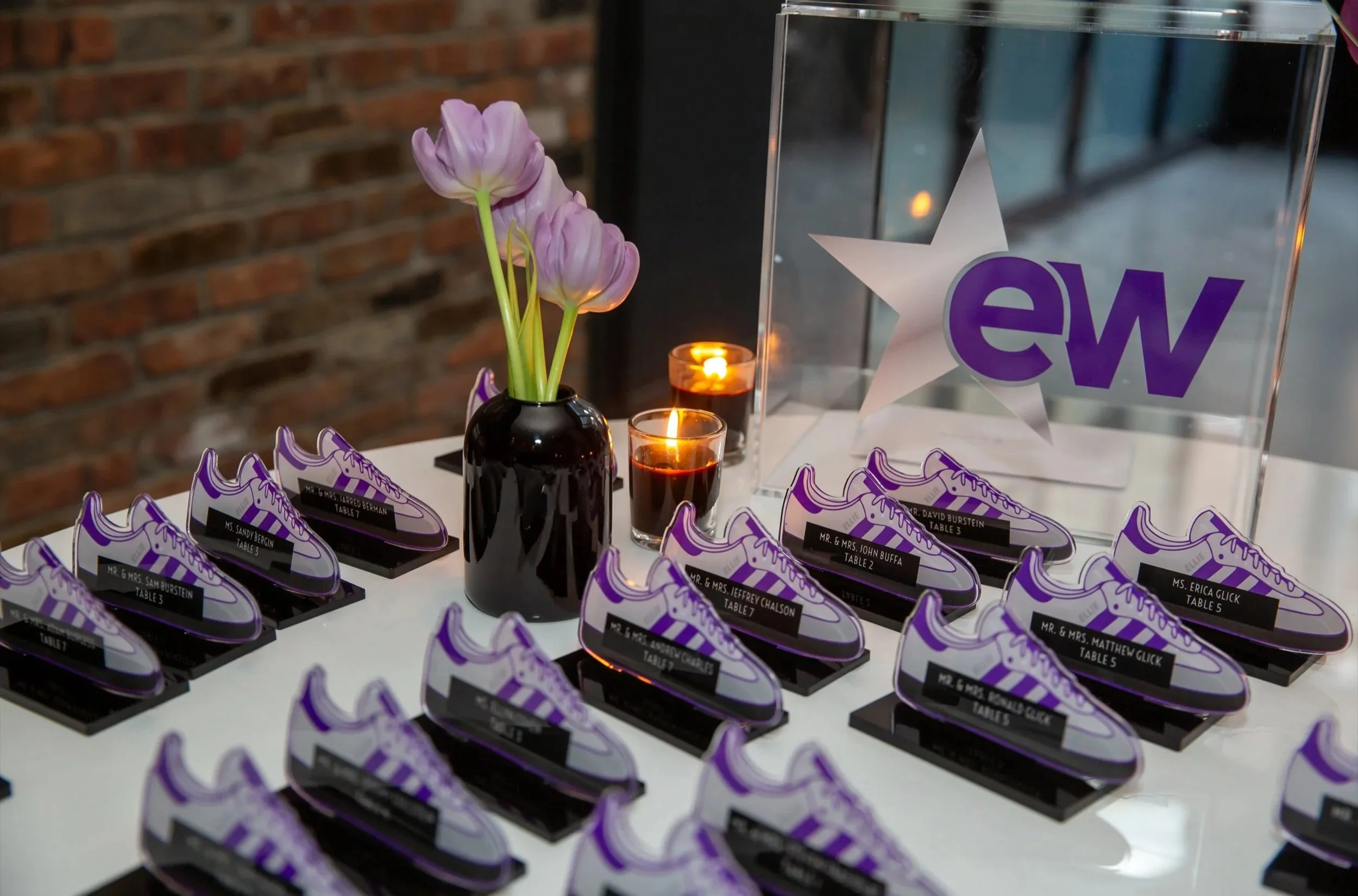 Purple and white Nike sneaker escort cards. 