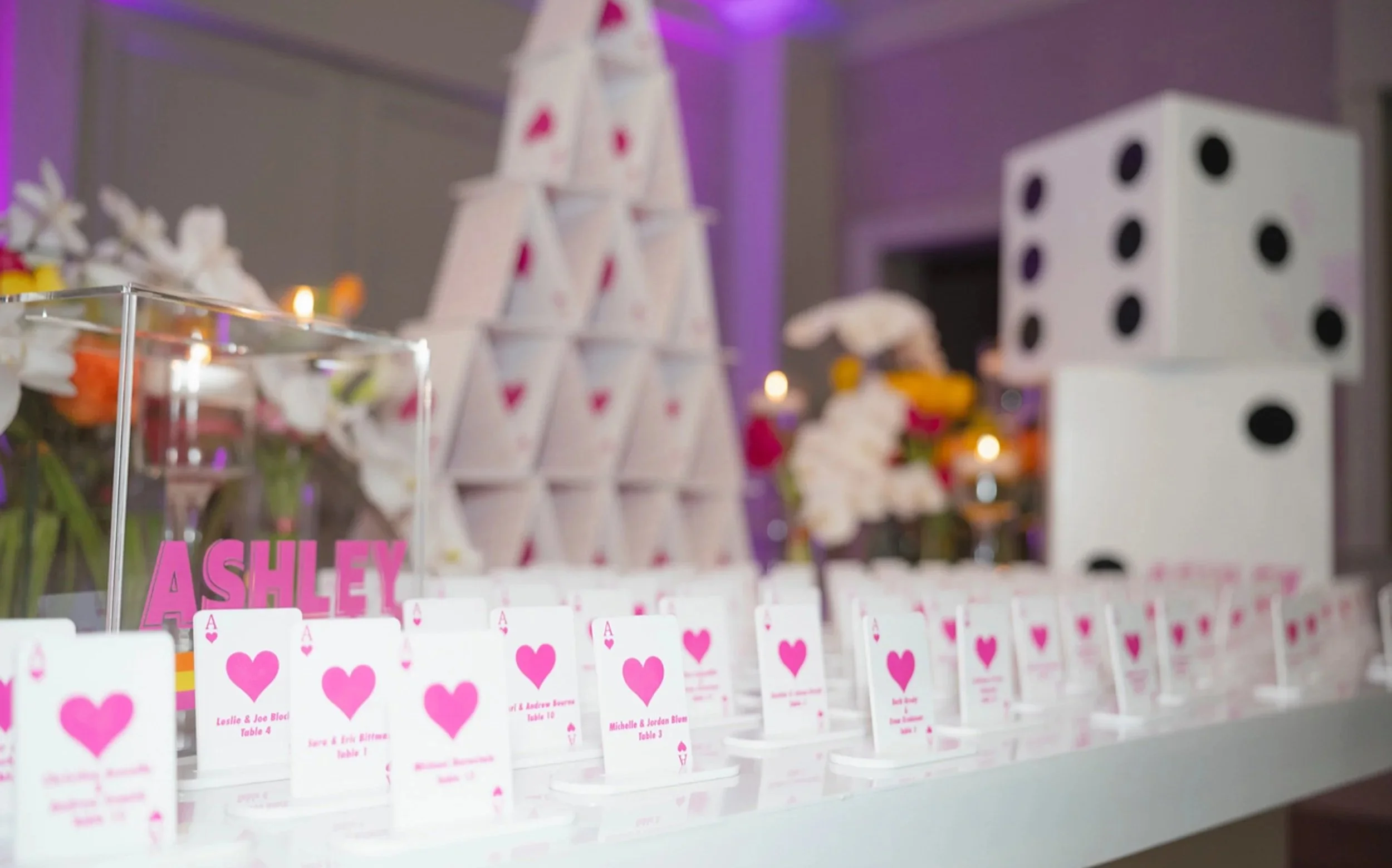 Custom pink and whit playing cards escort cards. 