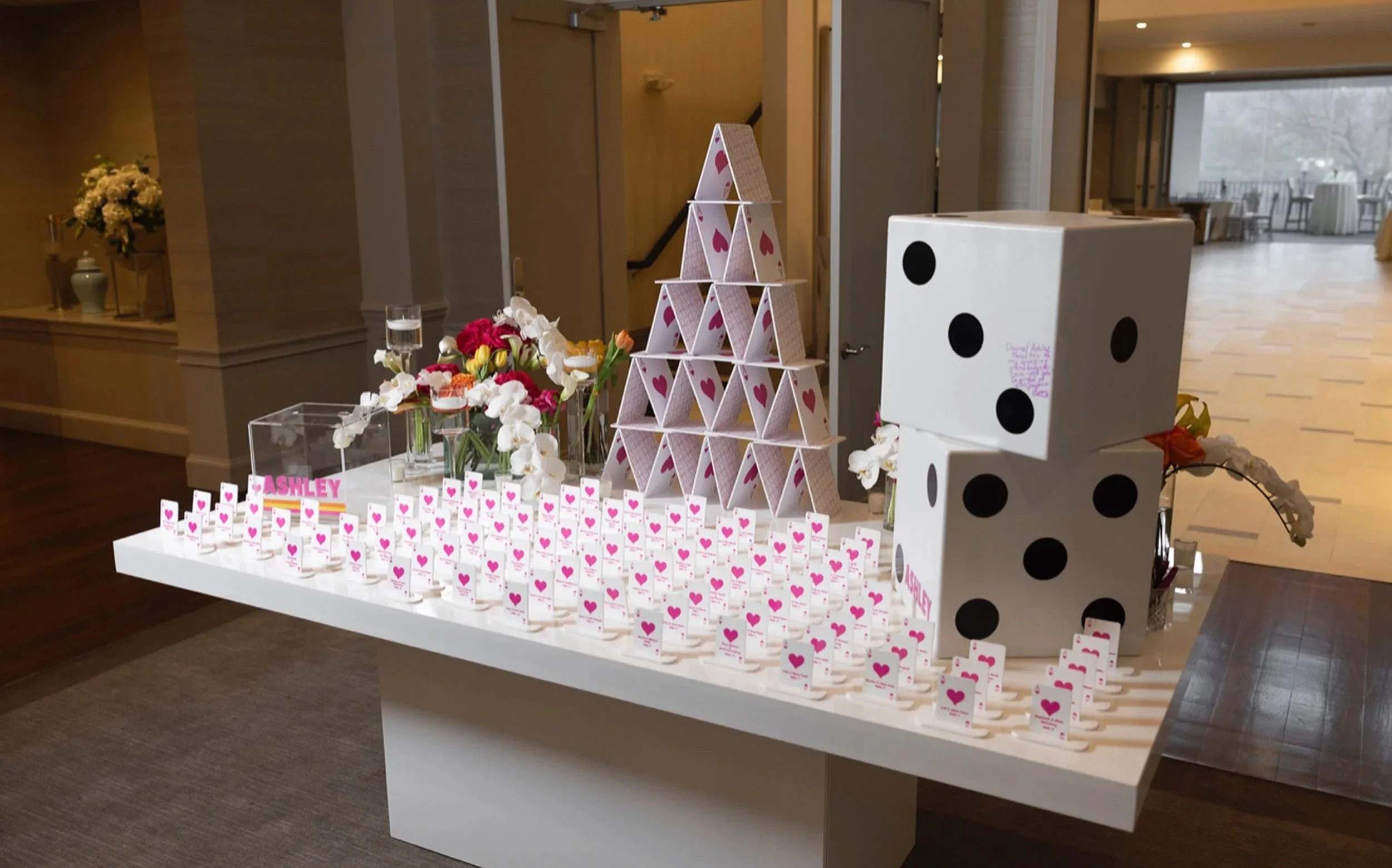 Custom pink and whit playing cards escort cards. 