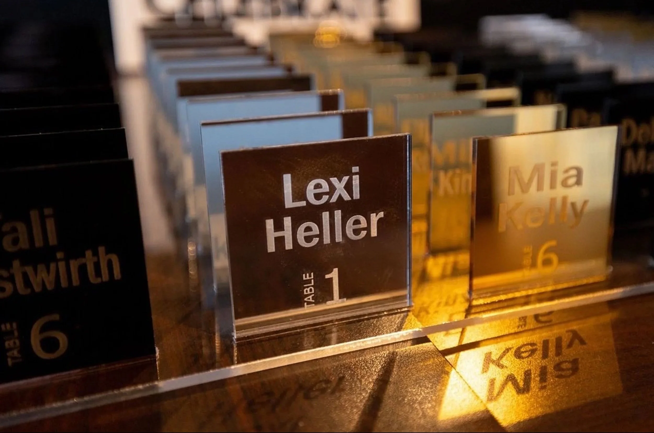 Custom mirrored acrylic escort cards. 