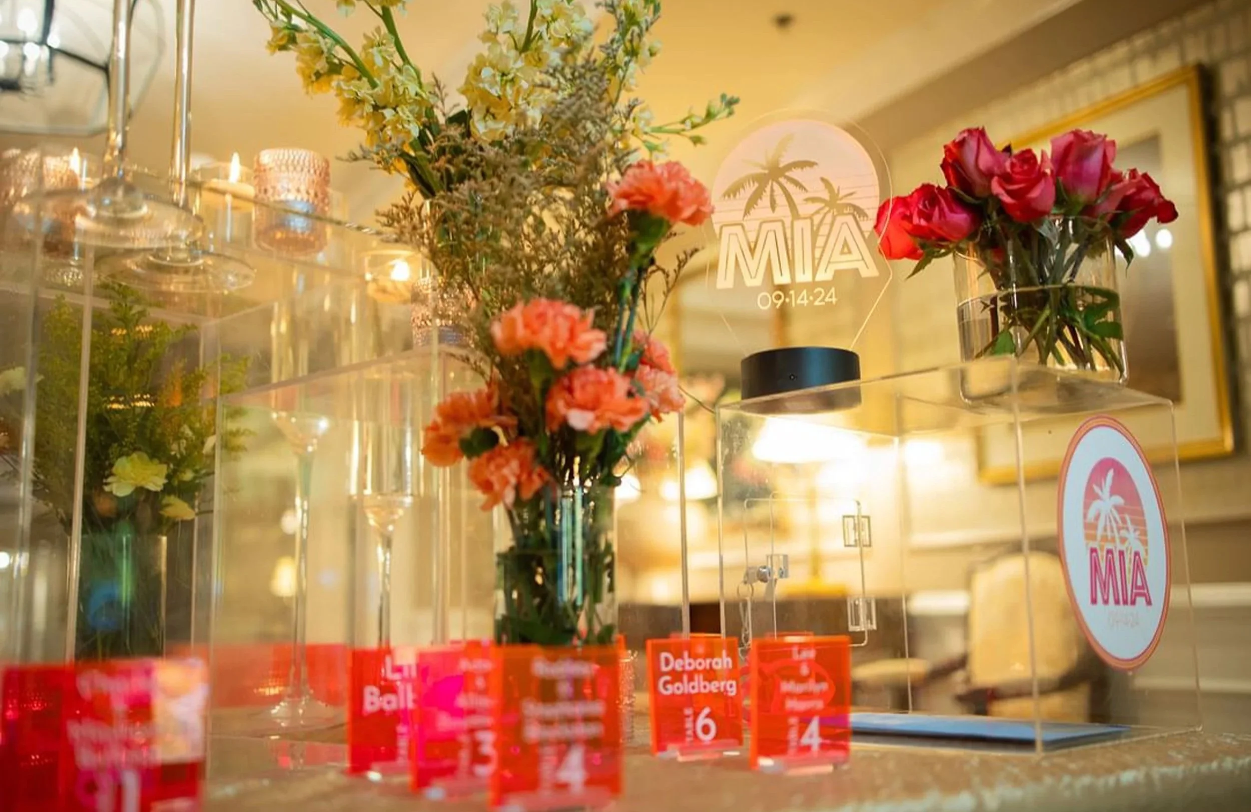 Pink and orange fluorescent escort cards. 