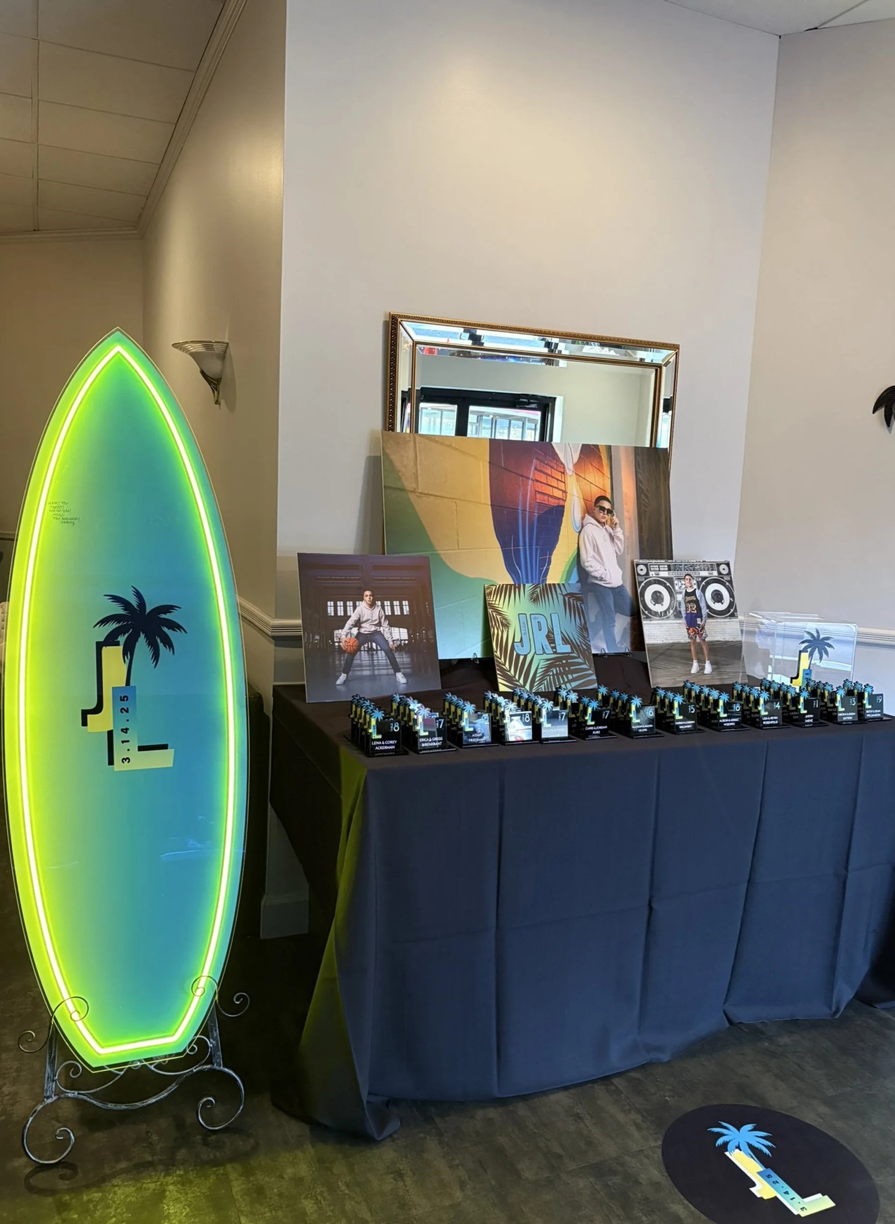 Tropical themed escort cards with a palm tree. 