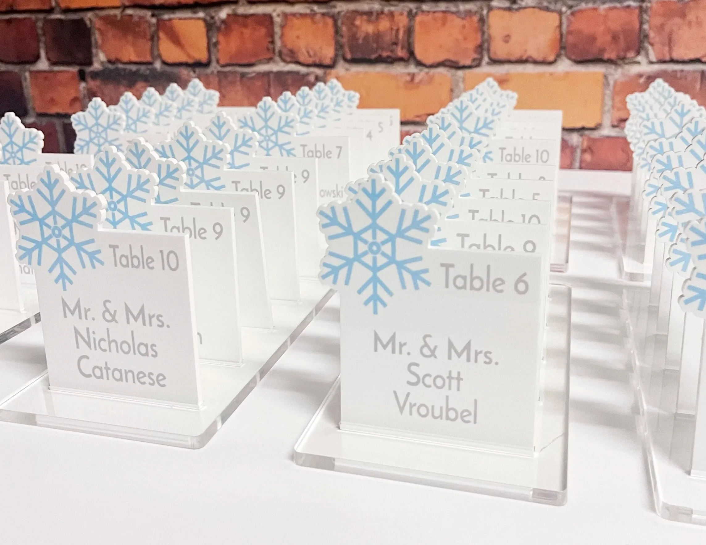 Custom winter themed escort cards with a snowflake. 
