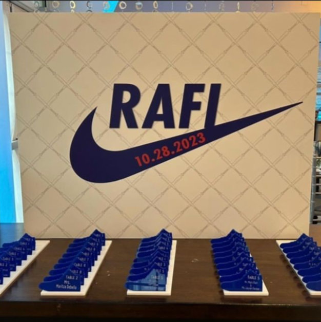 Custom blue sneaker shaped escort cards. 