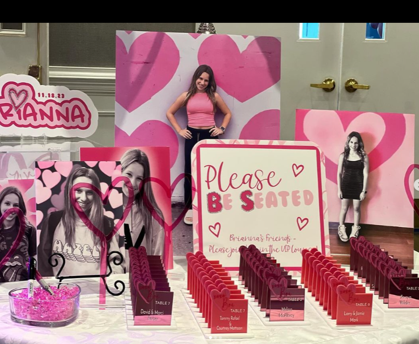 Custom pink escort cards with a heart. 