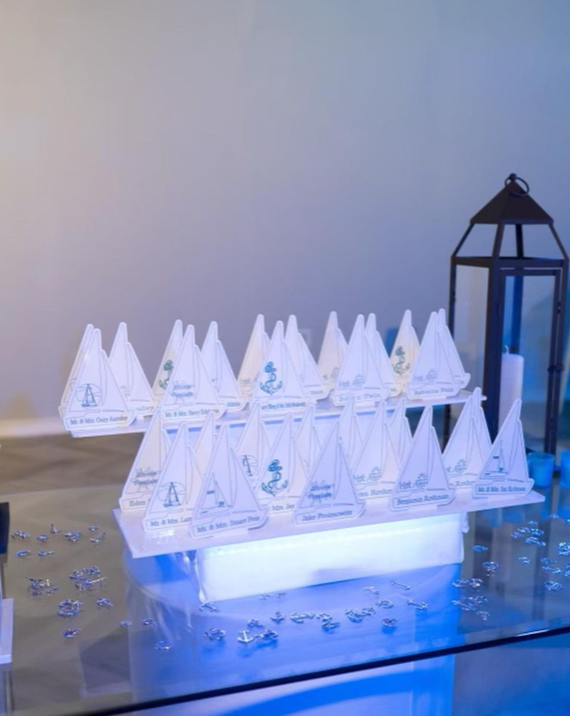 Custom sailboat-shaped escort cards. 