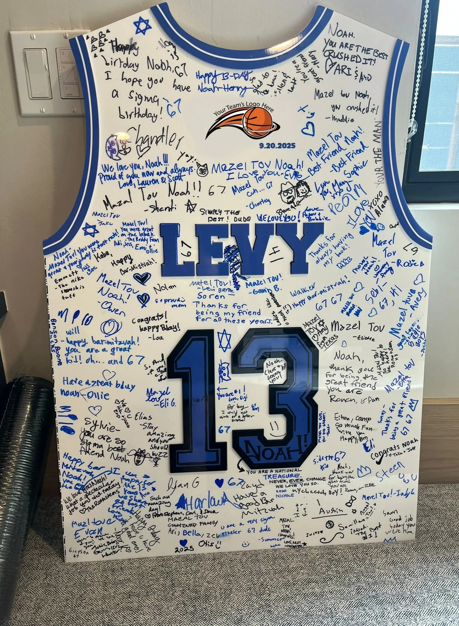 Custom white and blue basketball jersey sign-in board.