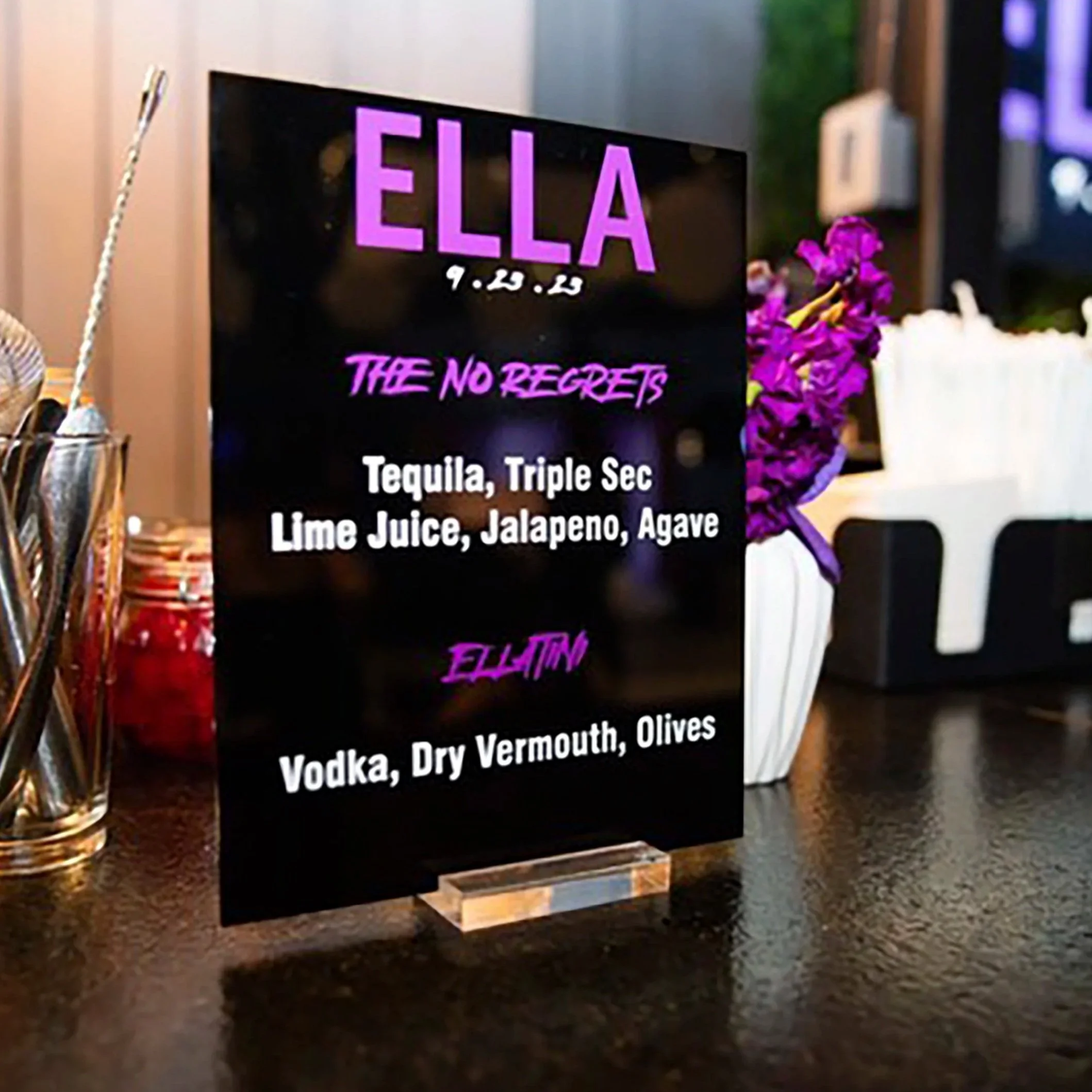 Custom black acrylic menu with purple detailing. 