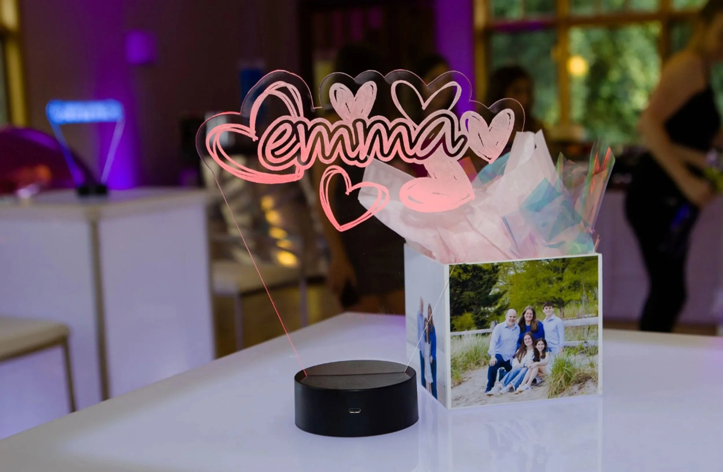 Custom LED centerpiece of a name with hearts. 