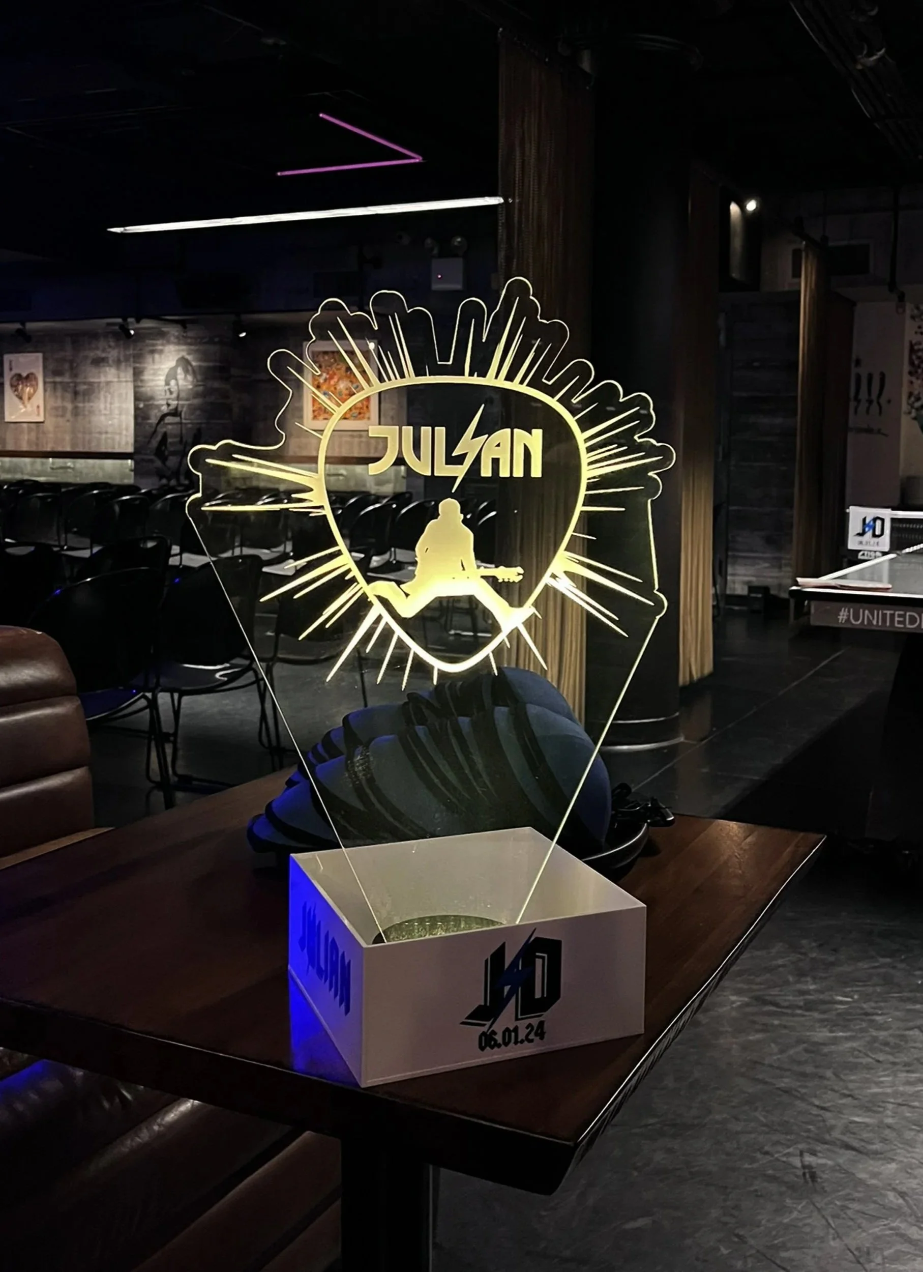 Custom large LED music-themed centerpiece of guitar pick. 