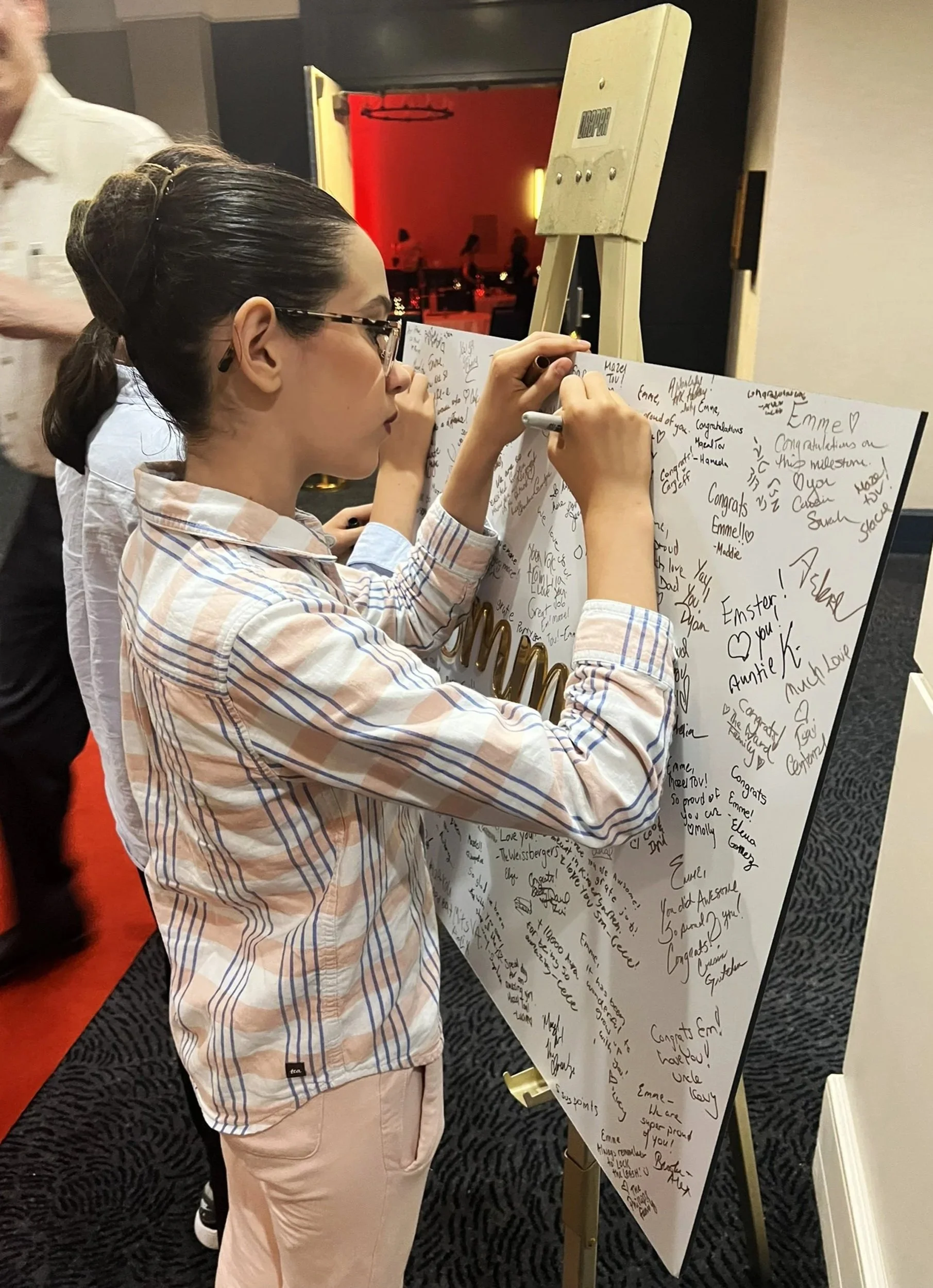 Emme+Being+Signed+at+Party.jpg