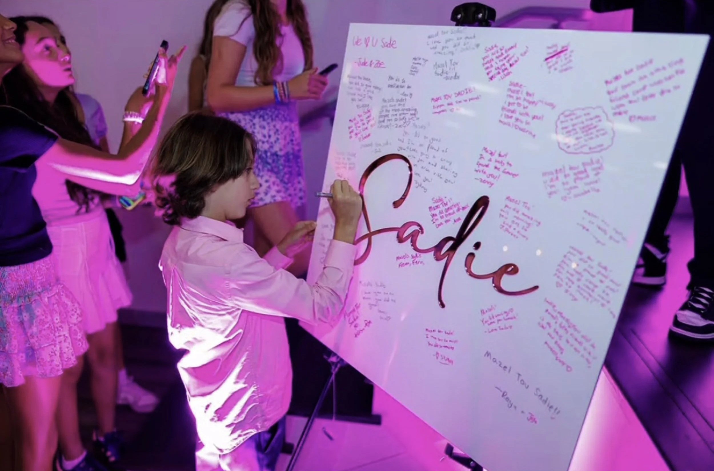 Sadie+Pink+Text+White+Board+Being+Signed.jpg