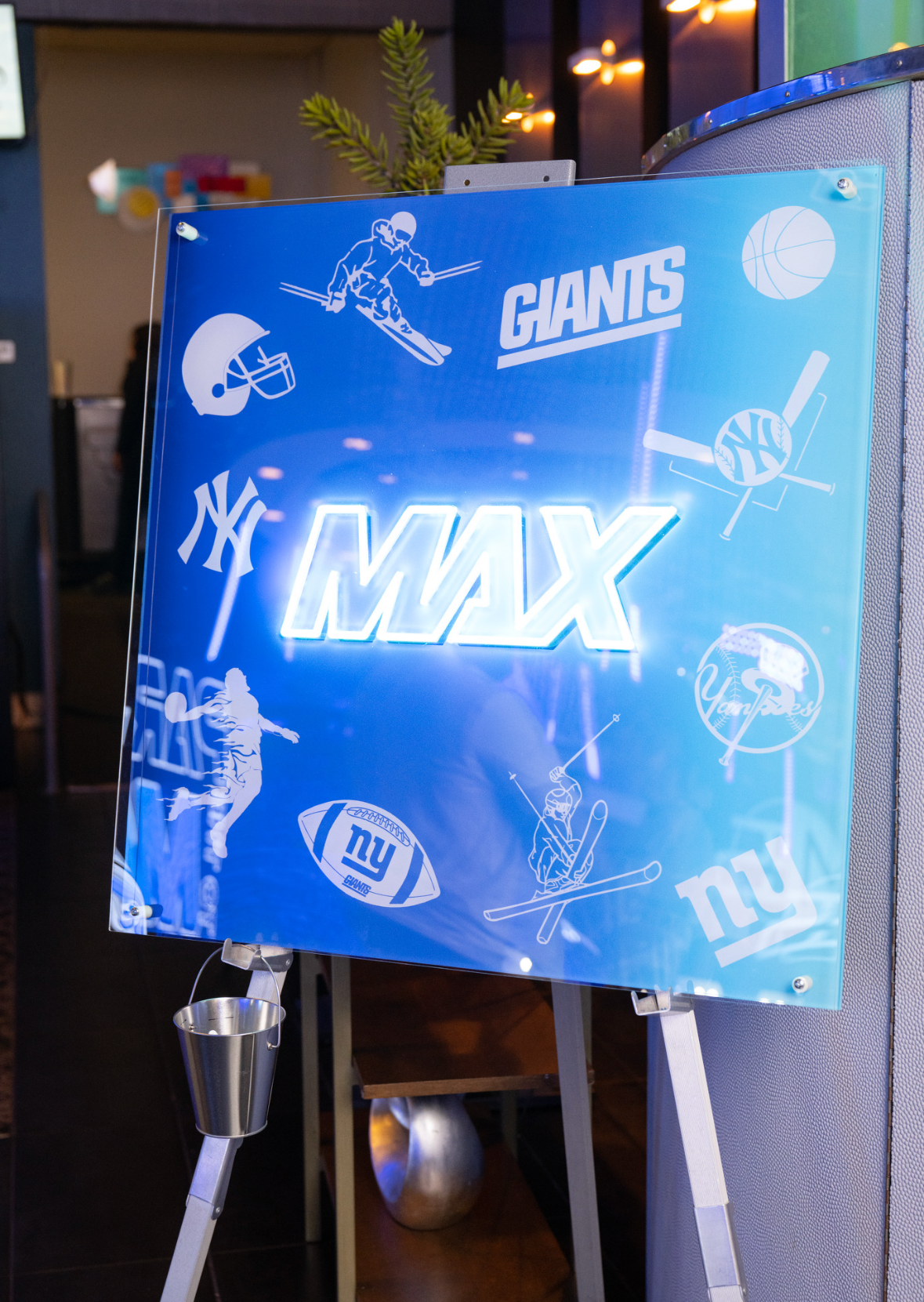 Custom sports themed neon sign-in board.