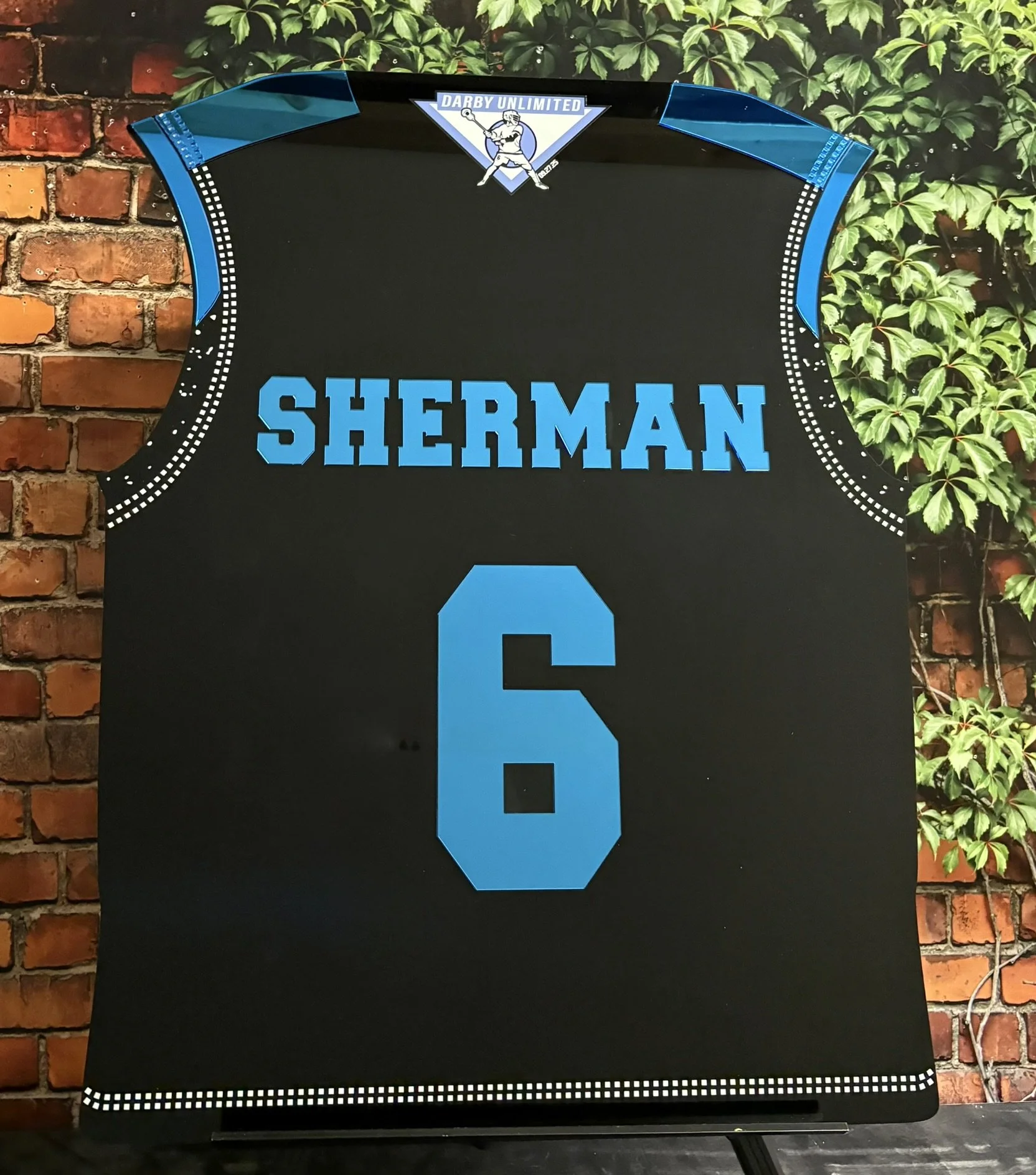 Custom black and blue lacrosse jersey sign-in board. 