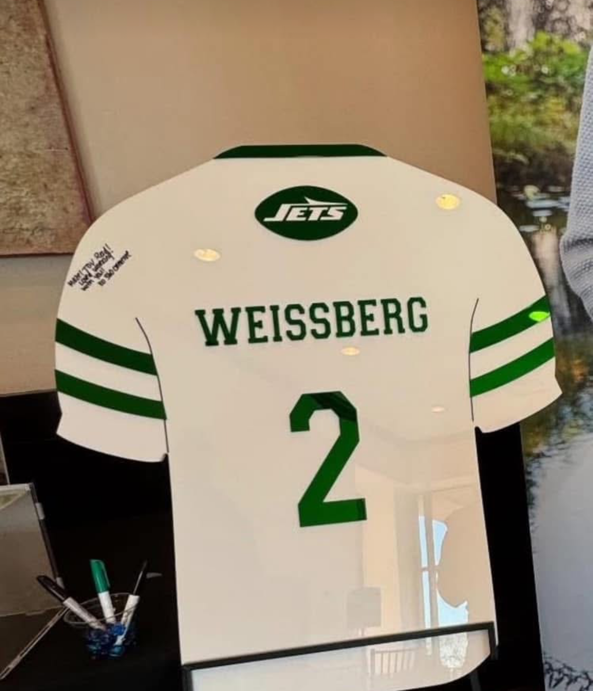 Custom New York Jets football jersey sign-in board.