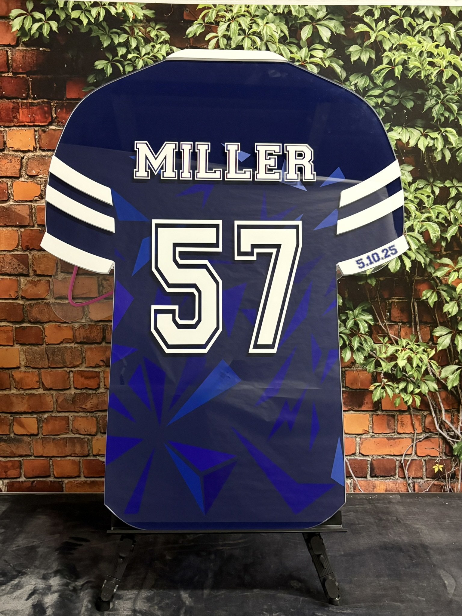 Custom blue and white soccer jersey sign-in board.