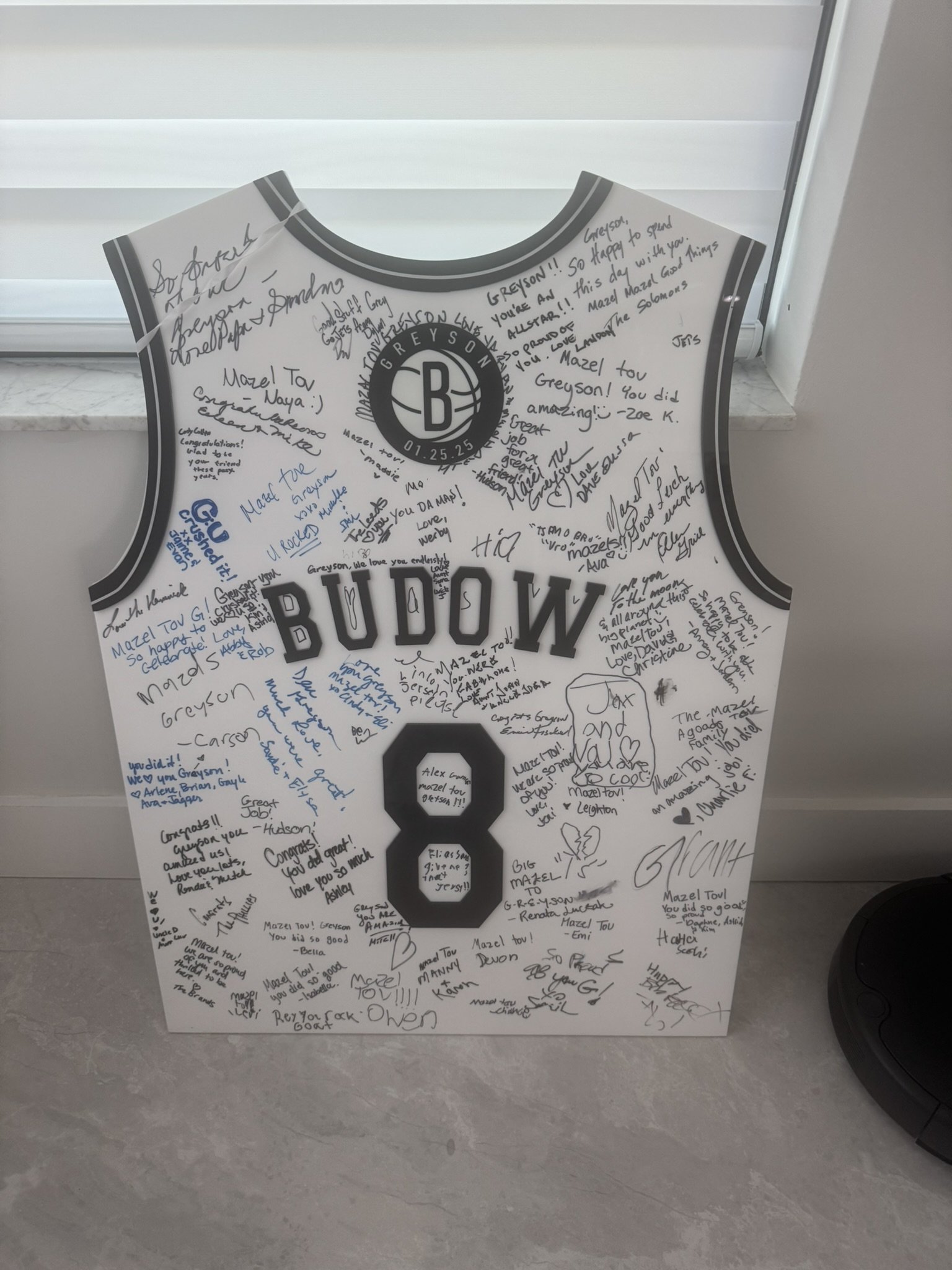 Custom white and black basketball jersey sign-in board.