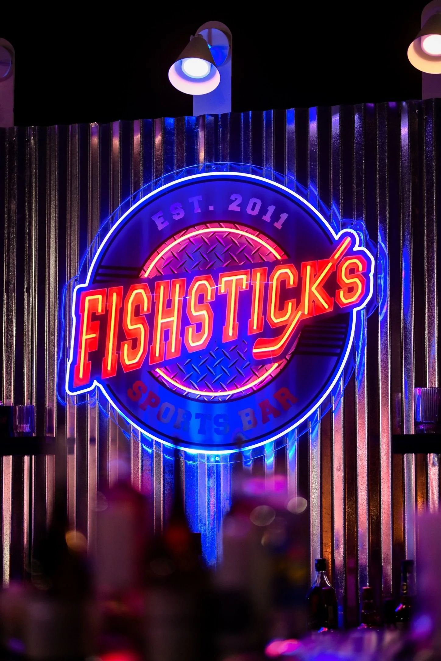 Neon Sign_Fishsticks_Hockey_Blue_Red_Yellow.JPEG