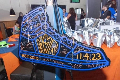 Custom sneaker sign in board with blue and gold detailing. 