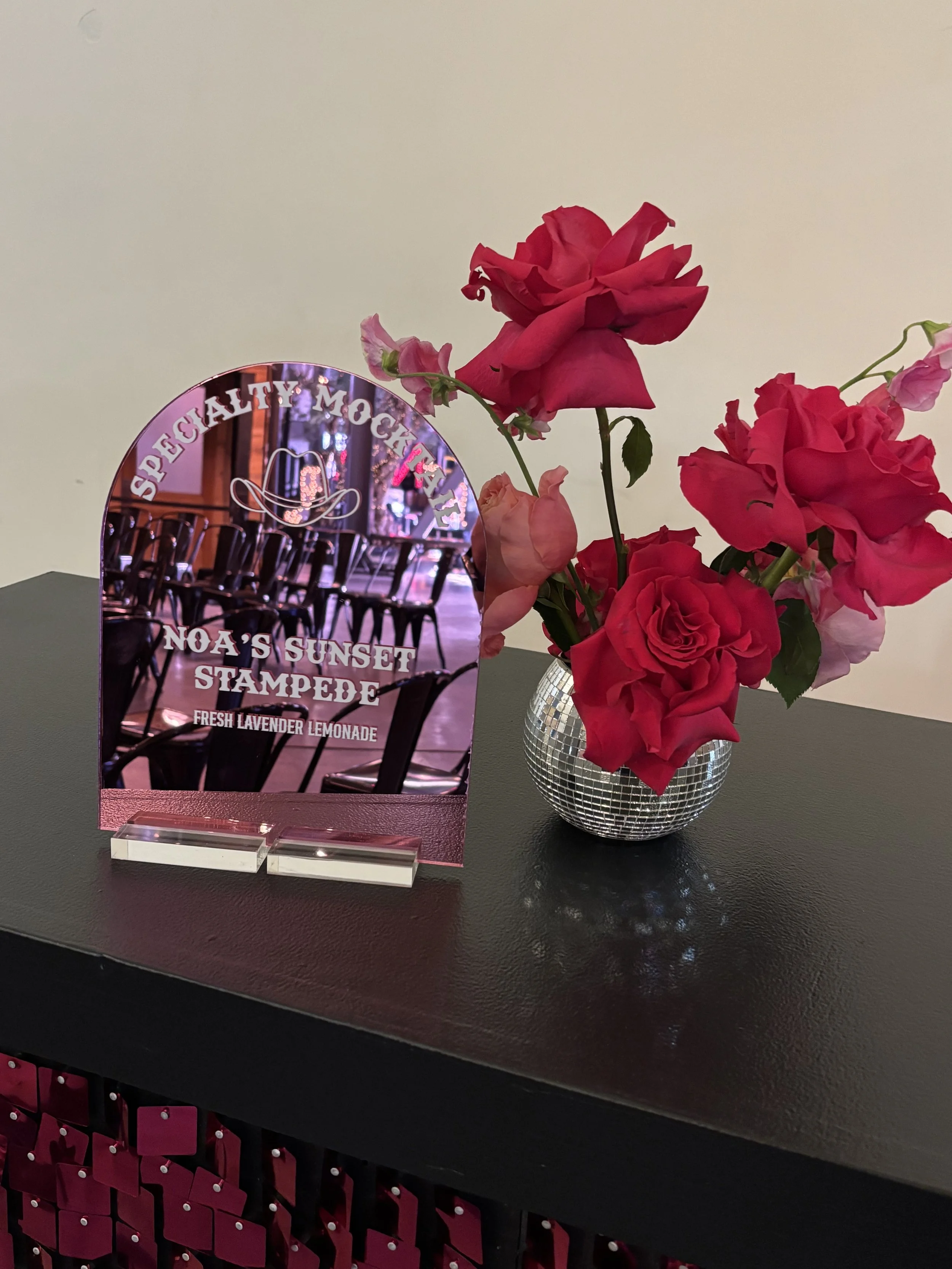 Custom western themed drink menu in pink mirror. 